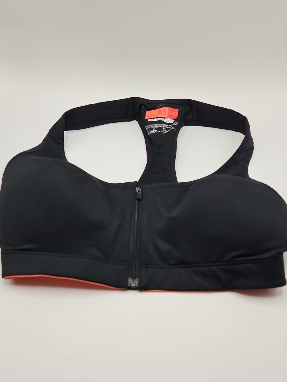 Under Armour Black Sports Bra with Front Zip and Subtle Orange Trim Heatgear 34D